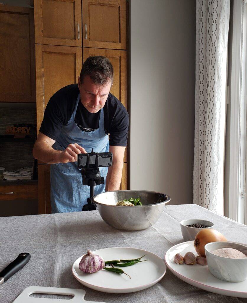 Food blogger is setting up his equipment for photo shoot, influencers in action